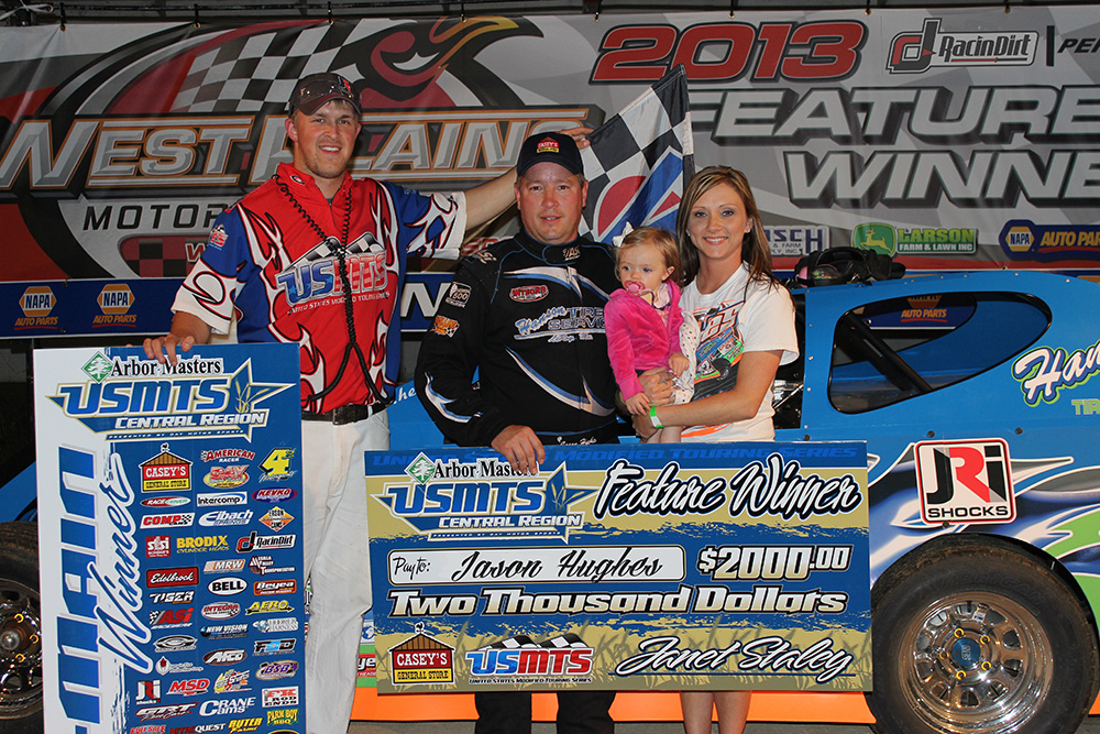 USMTS flagman Ryne Staley, Jason Hughes, daughter Jacie Hughes and wife Julie Hughes. (Trenton Berry Photo)