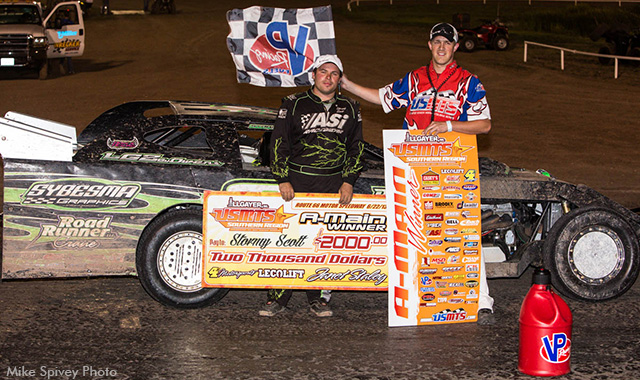 Stormy Scott in victory lane with USMTS flagman Ryne Staley. (Photo credit: Mike Spivey)